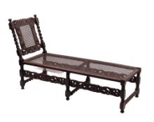 An oak and canework daybed in Jacobean taste,