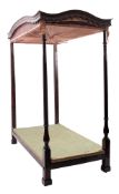 A stained and painted hardwood four-post bed, in George III style,