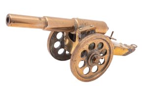 A brass model of a Great War era artillery piece or cannon,