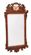 A parcel gilt and walnut framed wall mirror, in late George I style,