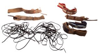 A quantity of leather bridles, some with nickel bits,