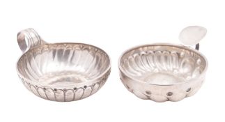 An 18th century French silver wine taster, circular form, with a fluted body and a pelleted border,