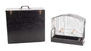 A wirework, repousse and amber glass mounted birdcage,