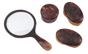 A pair of tortoiseshell dressing table brushes, circa 1900,