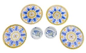 A mixed group of porcelain and faience plates variously decorated, all 20th century.