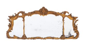 A gilt composition framed tripartite overmantel mirror in Rococo revival style,
