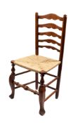An oak, ash and rush seated ladder back side chair,
