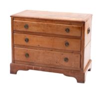 A pine coffer modelled as a late George III chest of drawers,