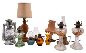 A pair of 20th Century cut glass oil lamps, together with other table lamps and glass shades, etc.