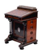 A Victorian walnut, ebonised and burr walnut banded Davenport in Aesthetic style,
