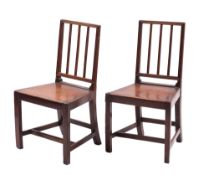 A pair of Regency oak panel seat side chairs,