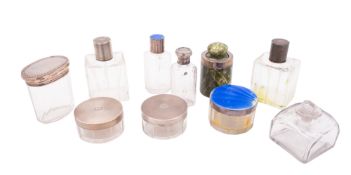 Eight silver mounted clear glass dressing table jars/ bottles,