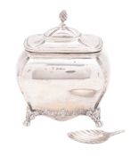 A late Victorian silver tea caddy, of rectangular bombé form, with a wrythen knop finial,