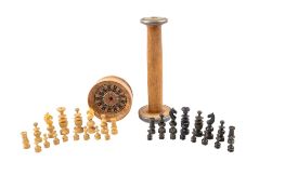 A boxwood chess set, together with a tin