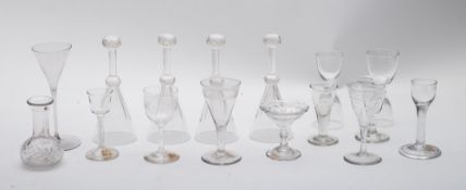 A mixed group of English and Dutch wine and other glasses including four stirrup glasses, rummers,