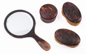 A pair of tortoiseshell dressing table brushes, circa 1900