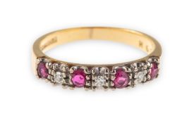 A ruby & diamond half eternity ring, claw set with four circular-cut rubies,