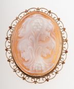 A 1970's 9ct gold cameo brooch, the cameo carving depicting three ladies, in a plain,