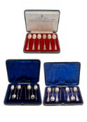 Three cased sets of silver teaspoons, a set of six, with matching sugar tongs,