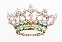An impressive late Edwardian diamond and emerald crown brooch, (circa 1905-1915),