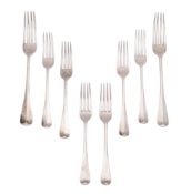 An Edwardian set of six silver dessert forks and a pair of matching tablespoons, Hanoverian pattern,
