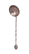 By A.E. Jones:- a George V small silver ladle,
