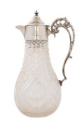 A late Victorian silver mounted clear cut-glass claret jug, with a baluster body,