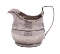 A George III Irish silver milk jug, oval form, with reeded borders,