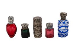 Five silver mounted glass scent bottles, two red examples, one with a blue & clear body,