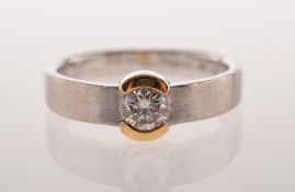 A modern 18ct gold diamond ring, a brushed white gold band,