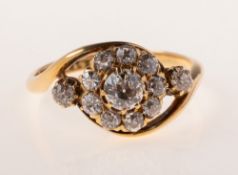 A Victorian 18ct gold diamond cluster ring, in the form of a flowerhead in a twist setting,
