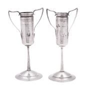 A pair of 19th century North-American silver vases, with cylindrical capitals,
