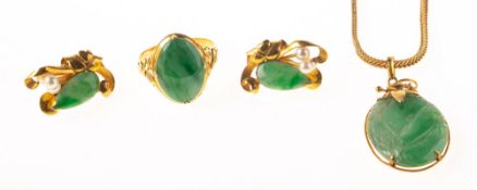A group of jade set jewellery, including a ring claw set with an oval-cut plaque of jade,