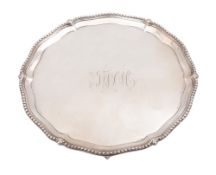 A George III small silver salver or waiter, of shaped circular outline,