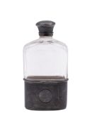 A Victorian silver mounted clear, cut-glass spirit flask, the mounts with engine-turned decoration,
