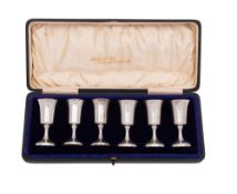 An early 20th century cased set of six small silver goblets,