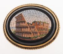 A Victorian Grand Tour mosaic brooch, depicting the Colosseum, with a gilt framed rope twist mount,