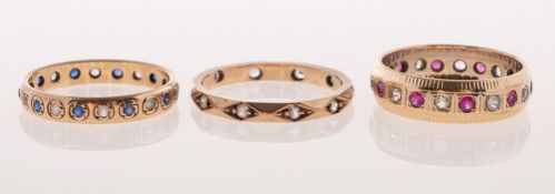 Three vintage varied design full eternity style rings,