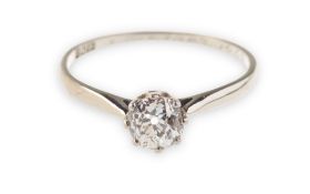 An early Art Deco diamond solitaire ring, eight claw set with an old European-cut diamond,