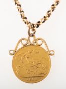 A half sovereign pendant with chain,