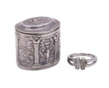 A modern silver ring box, oval form, with a hinged cover and embossed decoration,