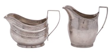 A George III North Country provincial silver cream jug, Helmet-shaped,