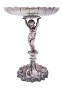 An Edwardian silver plated centrepiece, on a foliate scrolling base,