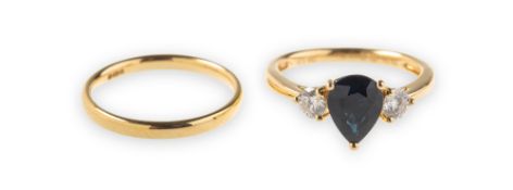 An 18ct gold sapphire and diamond three stone ring and an 18ct gold wedding band,