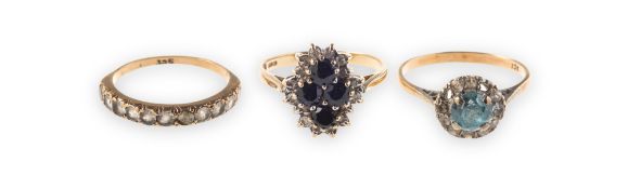 Five dress rings of varied design,