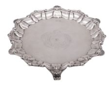 A late Victorian small silver salver/ waiter, of shaped circular outline,