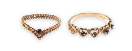 Two 9ct gold and sapphire rings of varied design,