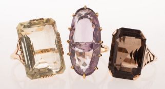 Three gemstone set cocktail rings of varied design,