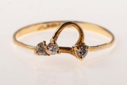 A diamond wirework ring, of abstract openwork form, claw set with three small single-cut diamonds,