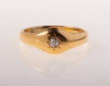 A diamond ring, star set with an old-cut diamond, unmarked yellow metal, evidence of re-sizing,
